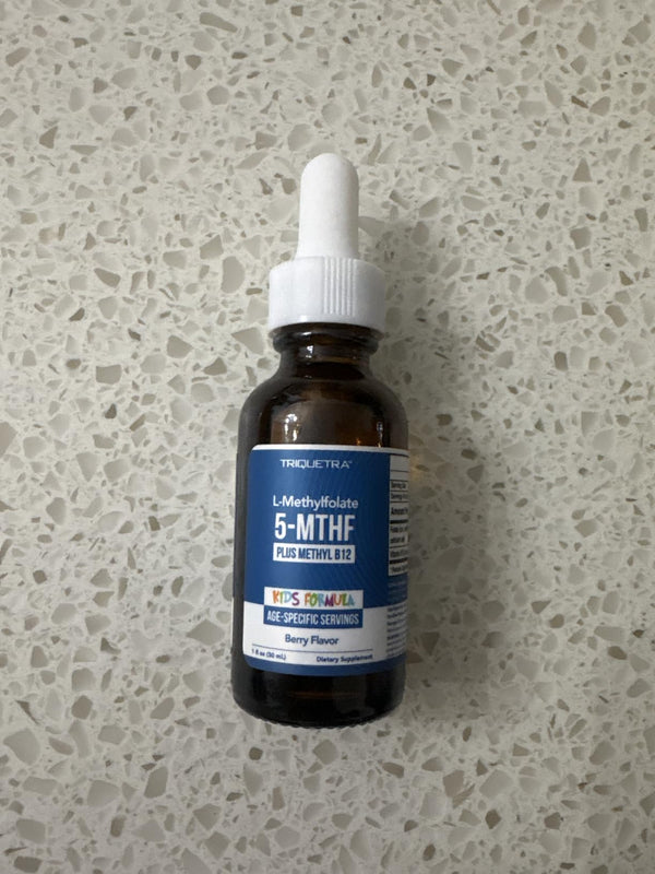 Triquetra Kids L-Methylfolate 5-MTHF bottle on a speckled countertop
